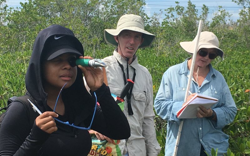 FIU undergraduate student using a salinity meter to measure salinity in Biscayne National Park